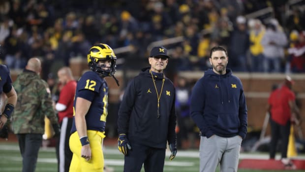 Michigan head coach Jim Harbaugh and ex-co-offensive coordinator Matt Weiss